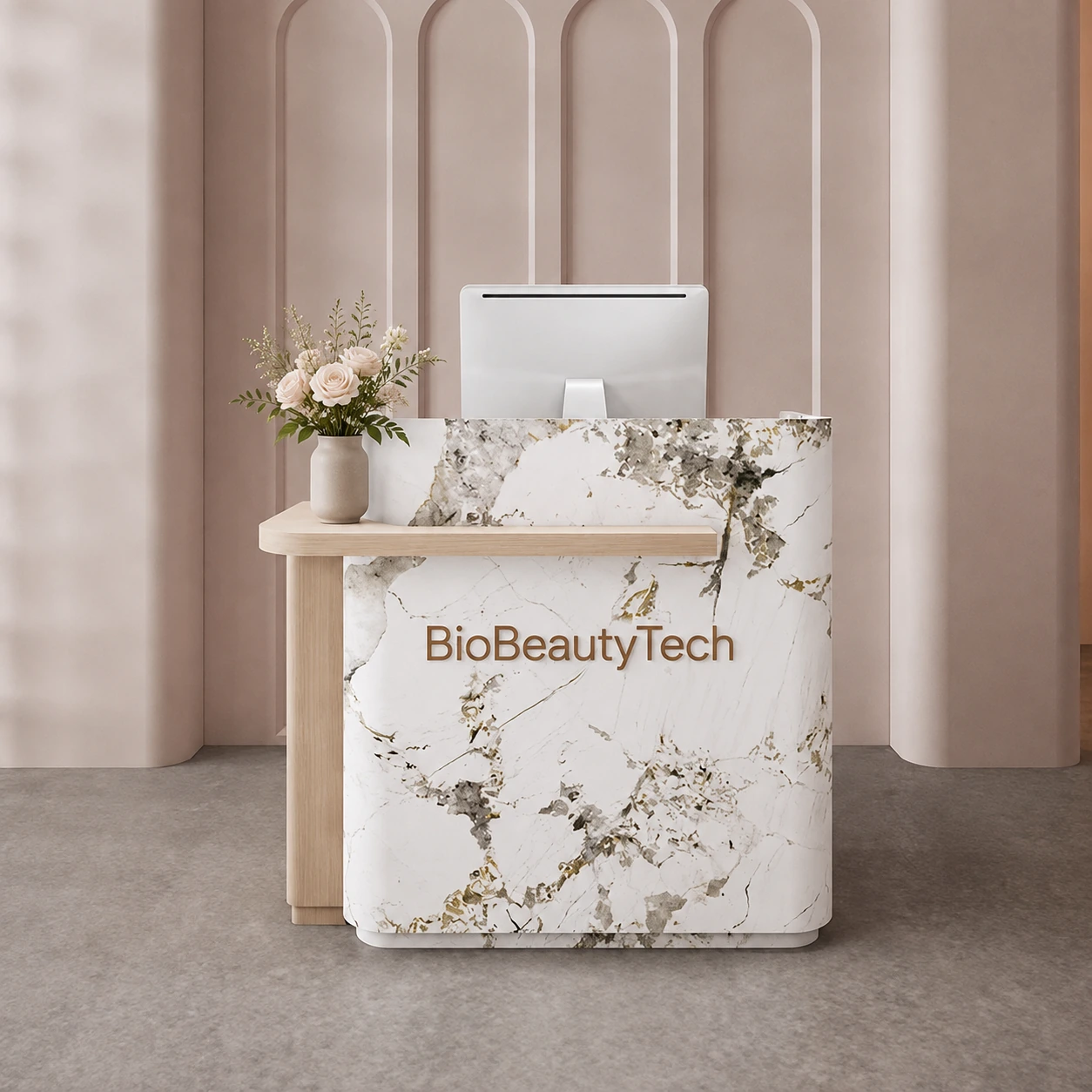 A reception counter clad in white and gold marble with BioBeautyTech lettering across the front, a pale oak console beside it against a fluted arched wall